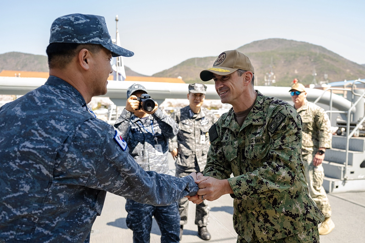 US Navy Personnel greeting Japanese military personnel