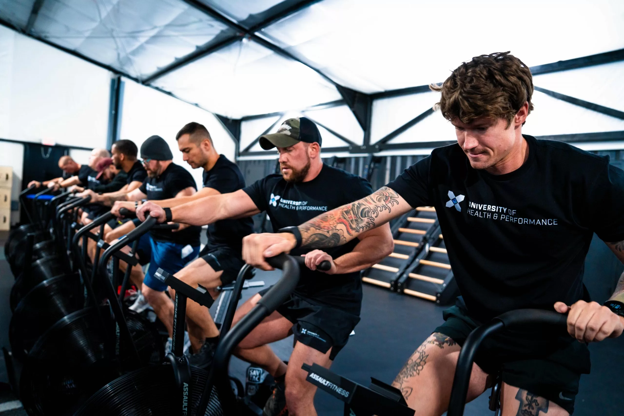 men working out on stationary bikes moral injury